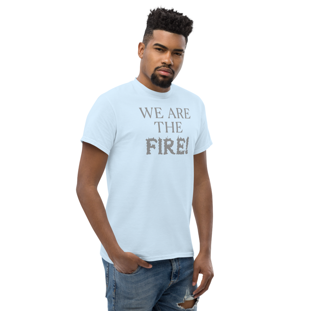 "We are the fire!" printed on a light blue unisex classic tee worn by a male