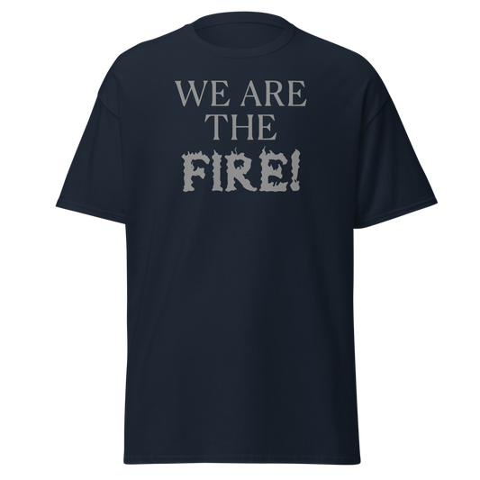 "We are the fire!" printed on a navy unisex classic tee laying on a flat surface