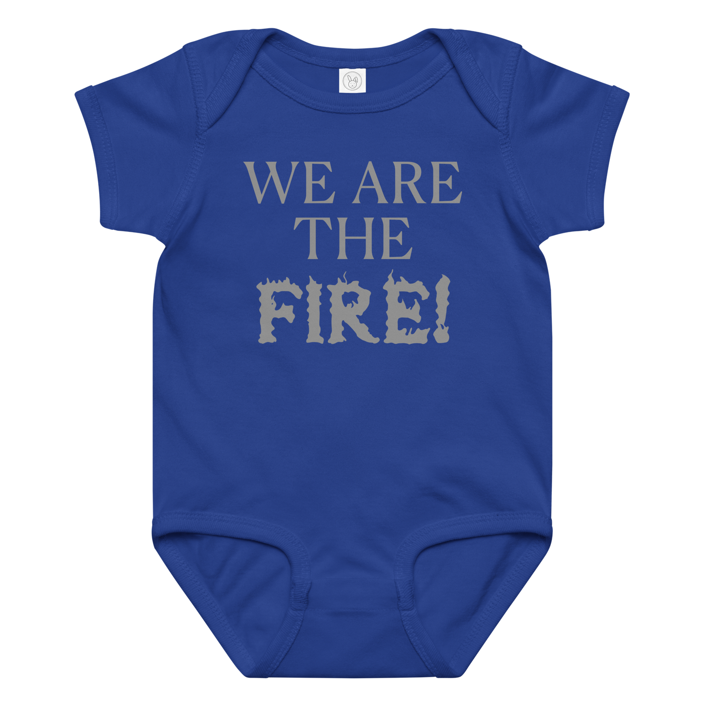 "We are the fire!" printed on a royal baby jersey bodysuit laying on a flat surface amongst other clothes