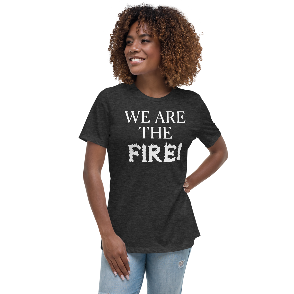 "We are the fire!" printed on a dark grey heather women's relaxed t-shirt worn by a female