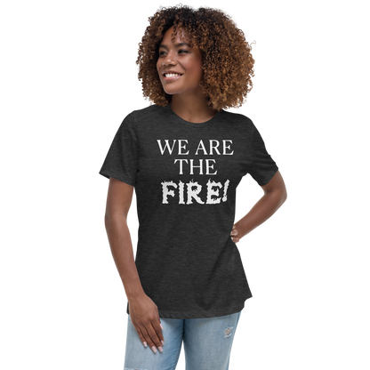 "We are the fire!" printed on a dark grey heather women's relaxed t-shirt worn by a female