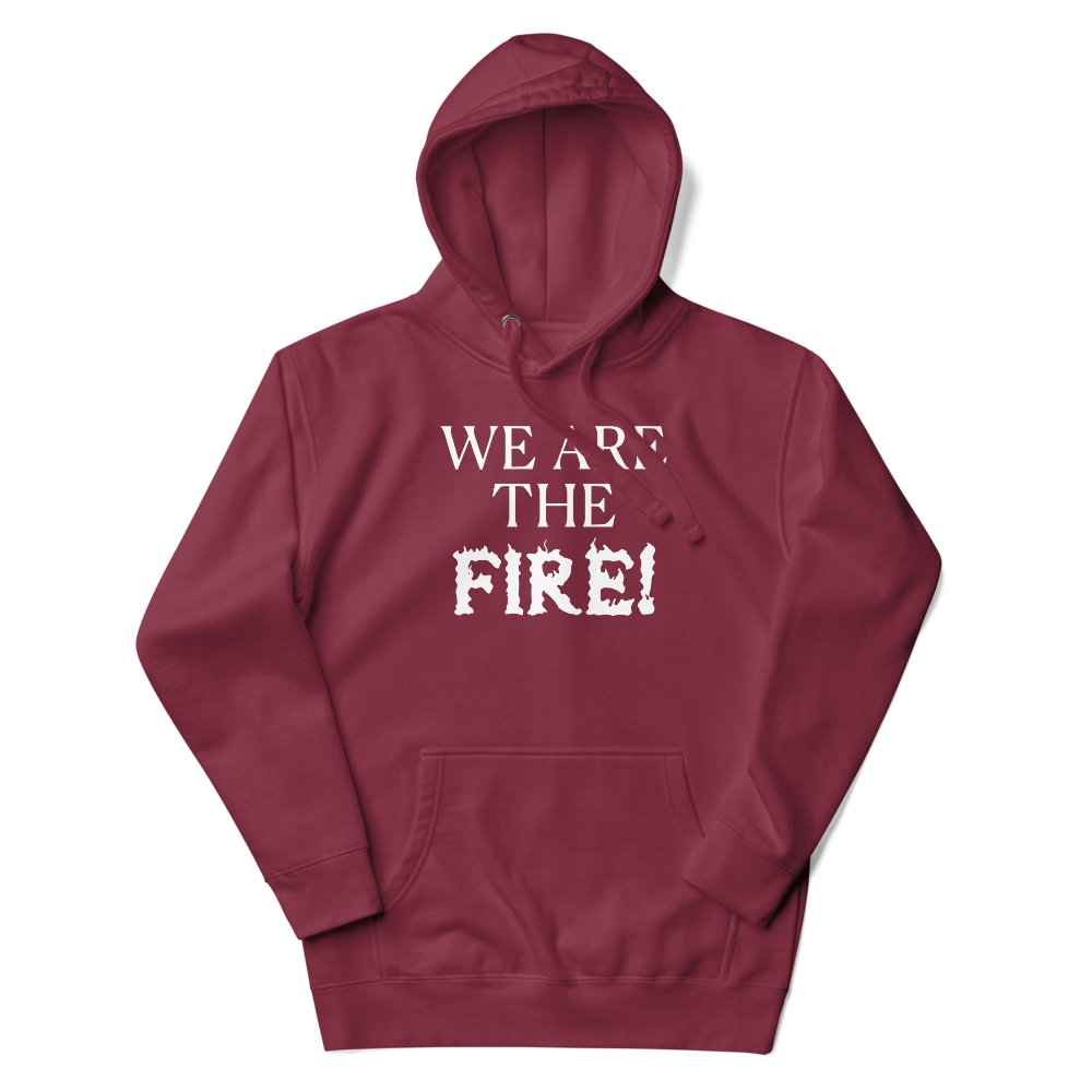 "We are the fire!" printed on a maroon unisex hoodie laying on a flat surface with the hood up