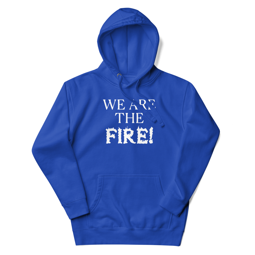 "We are the fire!" printed on a team royal unisex hoodie laying on a flat surface with the hood up
