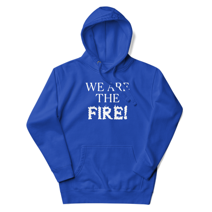 "We are the fire!" printed on a team royal unisex hoodie laying on a flat surface with the hood up
