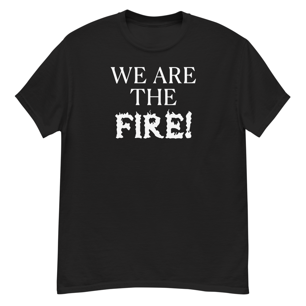 "We are the fire!" printed on a black unisex classic tee laying on a flat surface