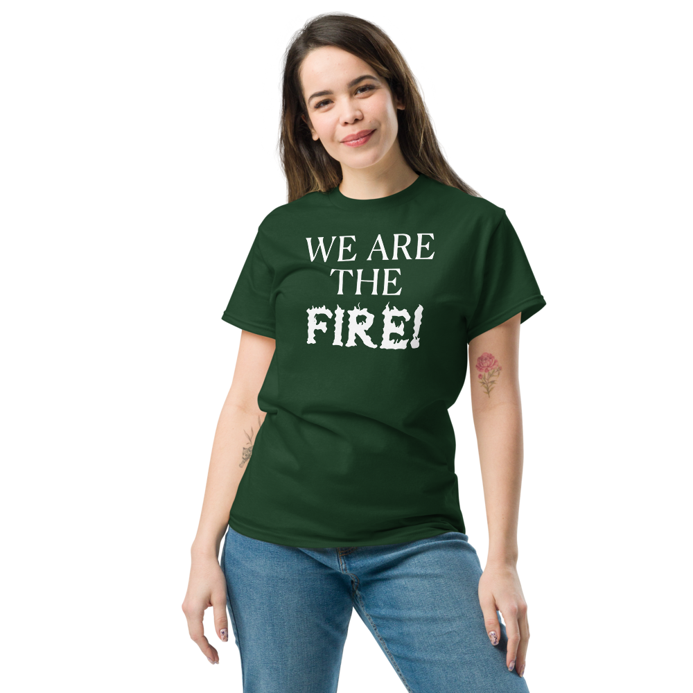 "We are the fire!" printed on a forest green unisex classic tee worn by a female