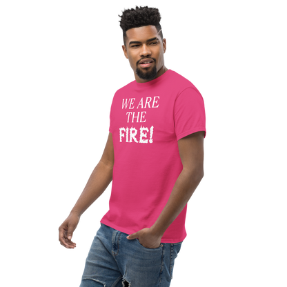 "We are the fire!" printed on a heliconia unisex classic tee worn by a male