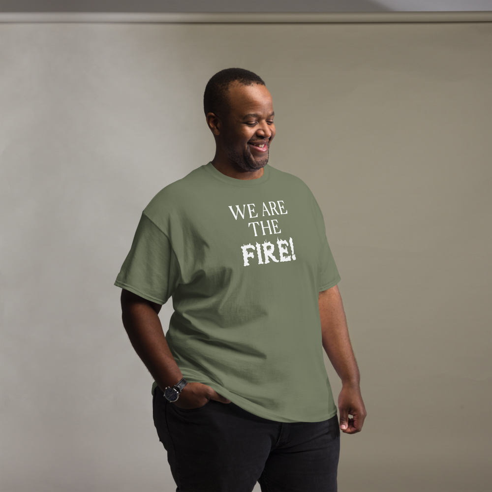 "We are the fire!" printed on a military green unisex classic tee worn by a male