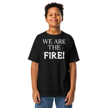 "We are the fire!" printed on a black youth classic tee worn by a male
