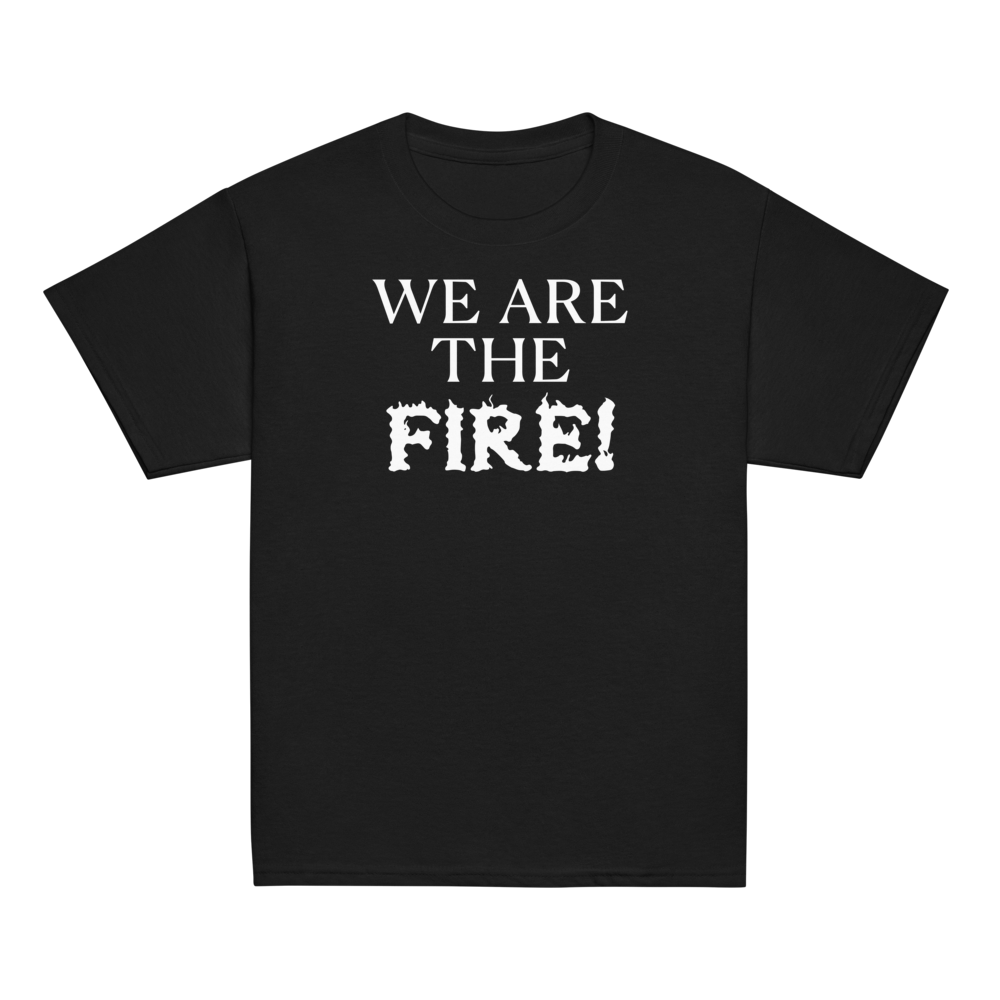 "We are the fire!" printed on a black youth classic tee laying on a flat surface