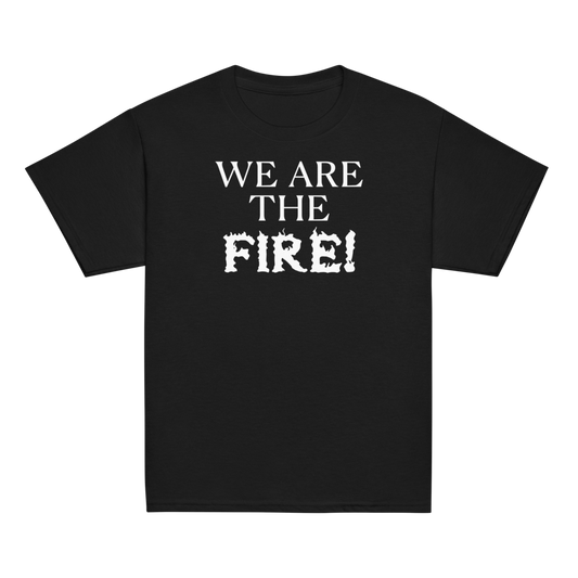 "We are the fire!" printed on a black youth classic tee laying on a flat surface
