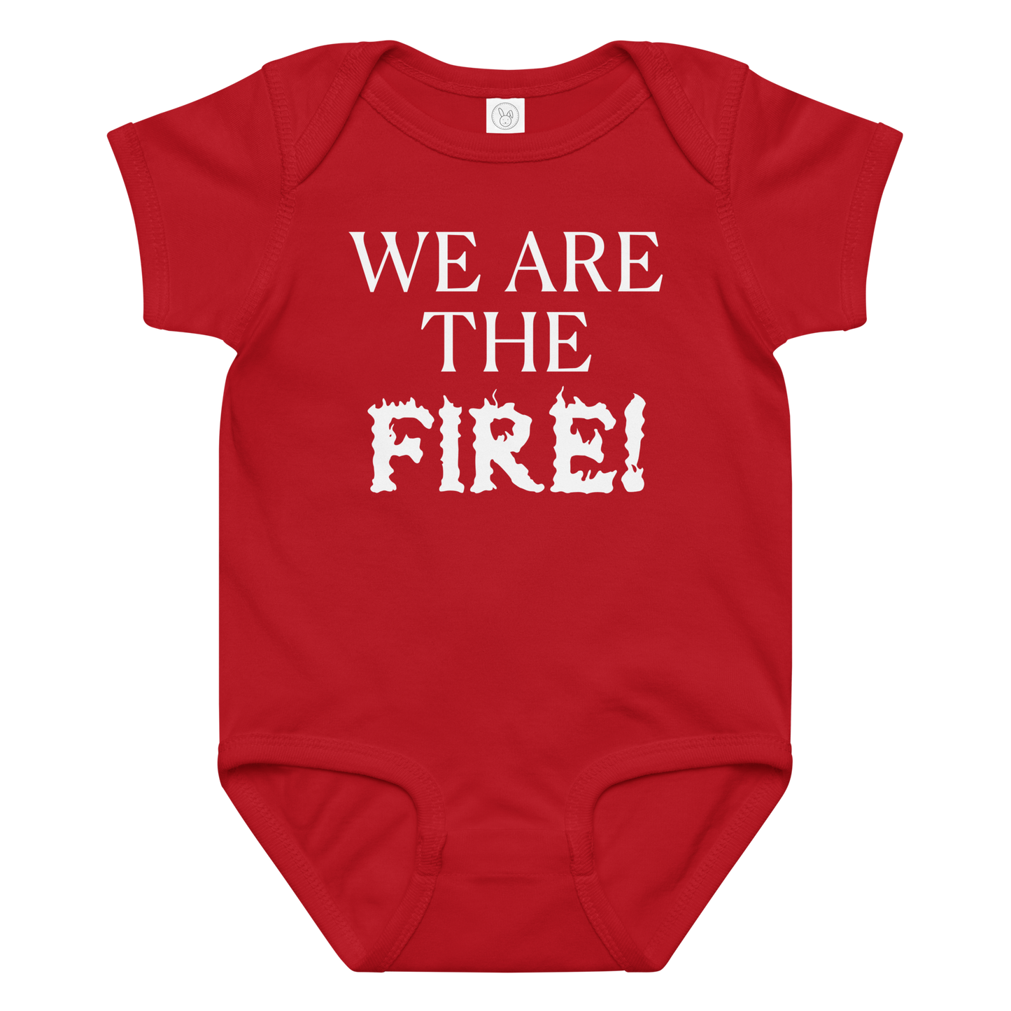 "We are the fire!" printed on a red baby jersey bodysuit laying on a flat surface amongst other clothes