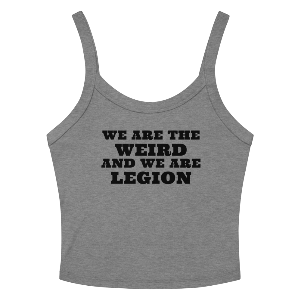 "We are the weird and we are legion" printed on a athletic heather women's micro-rib tanktop laying on a flat surface amongst sunglasses and shorts