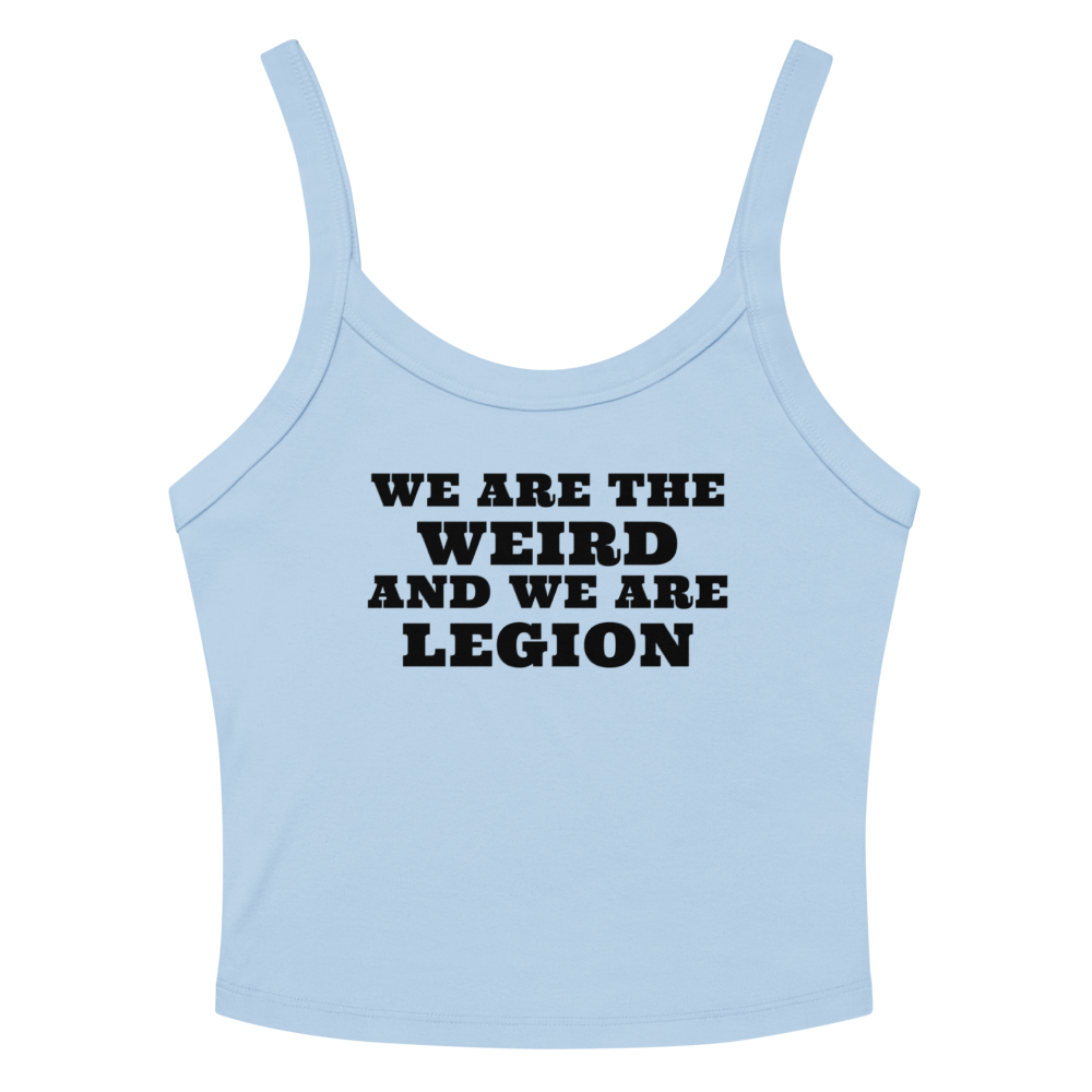 "We are the weird and we are legion" printed on a solid baby blue blend women's micro-rib tanktop laying on a flat surface amongst sunglasses and shorts