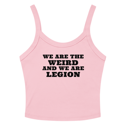 "We are the weird and we are legion" printed on a solid pink blend women's micro-rib tanktop laying on a flat surface amongst sunglasses and shorts