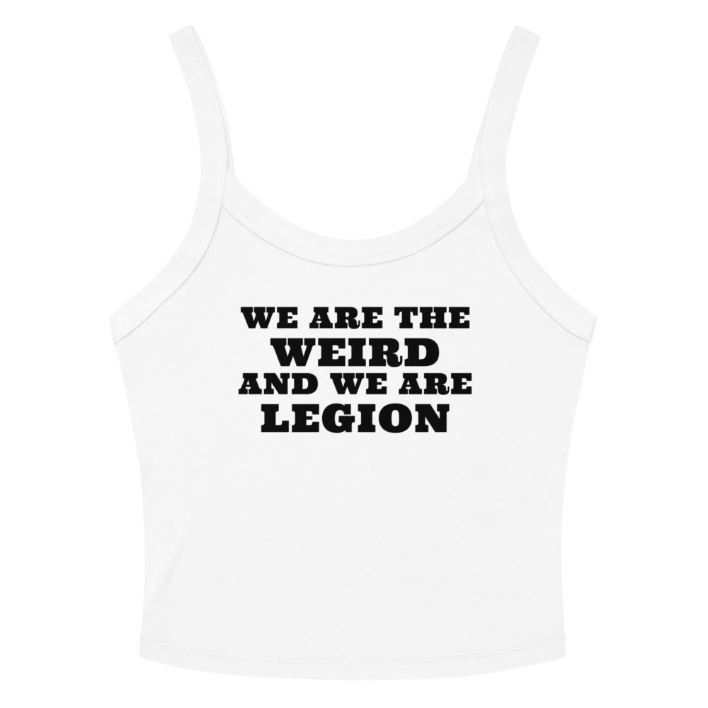 "We are the weird and we are legion" printed on a solid white blend women's micro-rib tanktop laying on a flat surface amongst sunglasses and shorts
