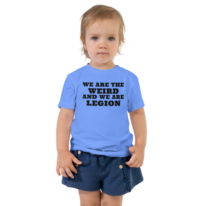 "We are the weird and we are legion" printed on a heather columbia blue toddler short sleeve tee worn by a female
