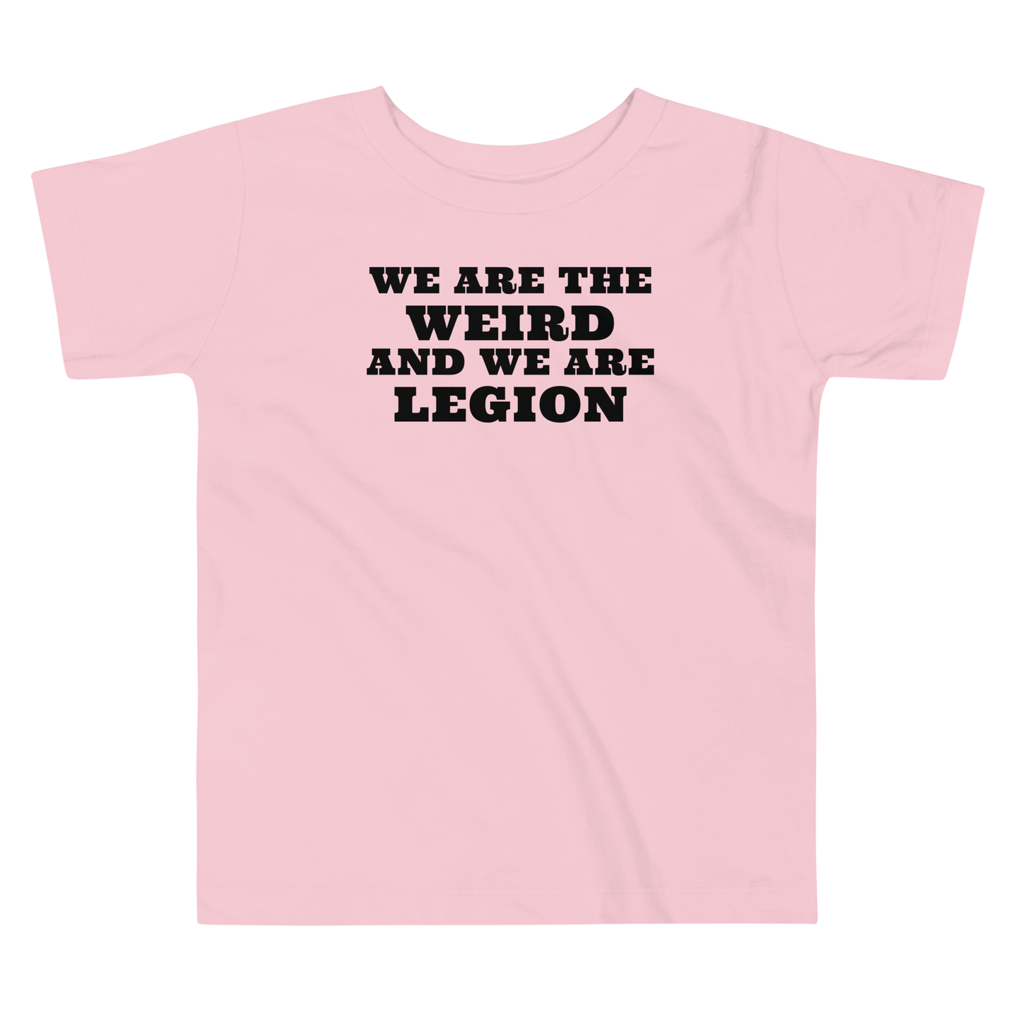 "We are the weird and we are legion" printed on a pink toddler short sleeve tee laying on a flat surface