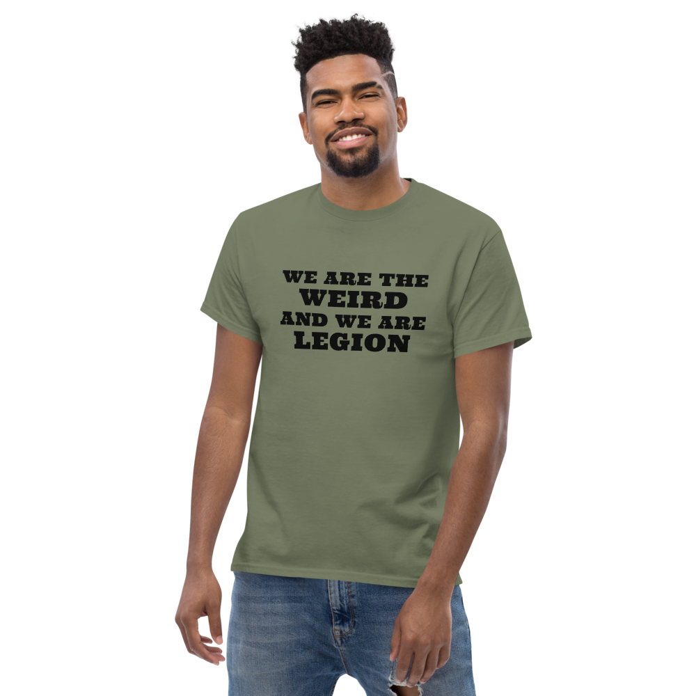 "We are the weird and we are legion" printed on a military green unisex classic tee worn by a male