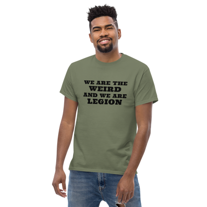"We are the weird and we are legion" printed on a military green unisex classic tee worn by a male