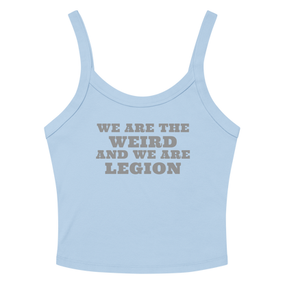 "We are the weird and we are legion" printed on a solid baby blue blend women's micro-rib tanktop laying on a flat surface amongst sunglasses and shorts