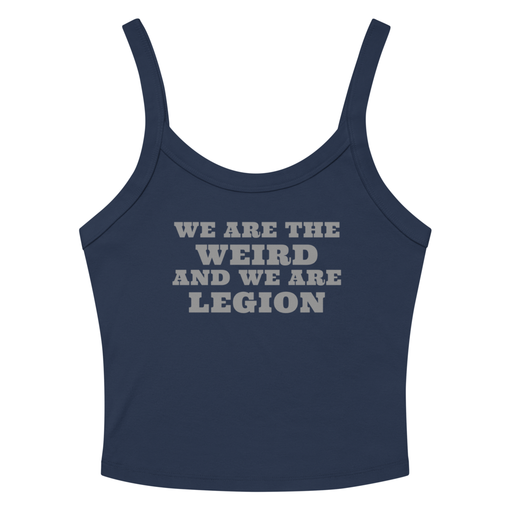 "We are the weird and we are legion" printed on a solid navy blend women's micro-rib tanktop laying on a flat surface amongst sunglasses and shorts