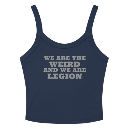 "We are the weird and we are legion" printed on a solid navy blend women's micro-rib tanktop laying on a flat surface amongst sunglasses and shorts