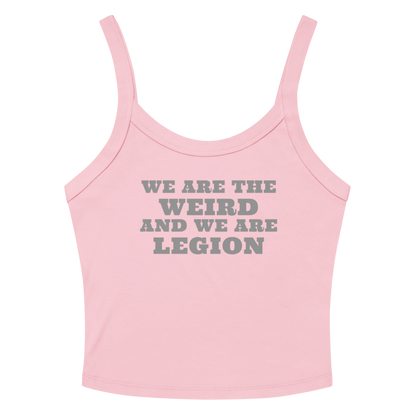 "We are the weird and we are legion" printed on a solid pink blend women's micro-rib tanktop laying on a flat surface amongst sunglasses and shorts
