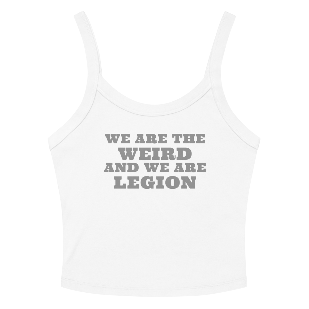 "We are the weird and we are legion" printed on a solid white blend women's micro-rib tanktop laying on a flat surface amongst sunglasses and shorts