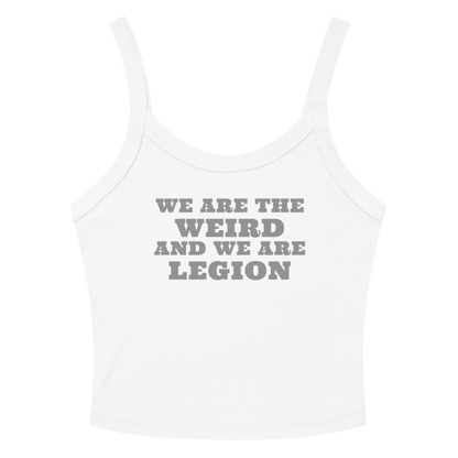 "We are the weird and we are legion" printed on a solid white blend women's micro-rib tanktop laying on a flat surface amongst sunglasses and shorts