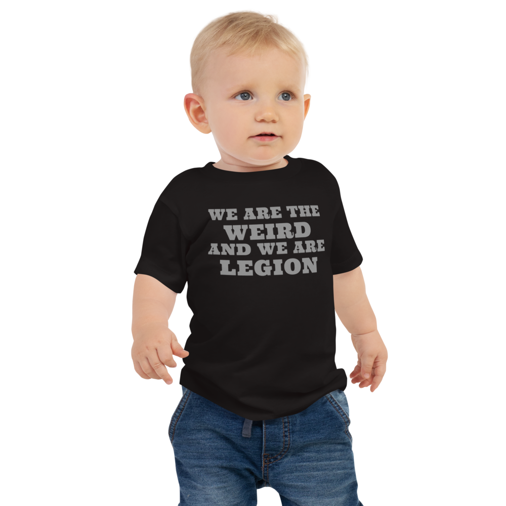 "We are the weird and we are legion" printed on a black baby jersey short sleeve tee worn by a male