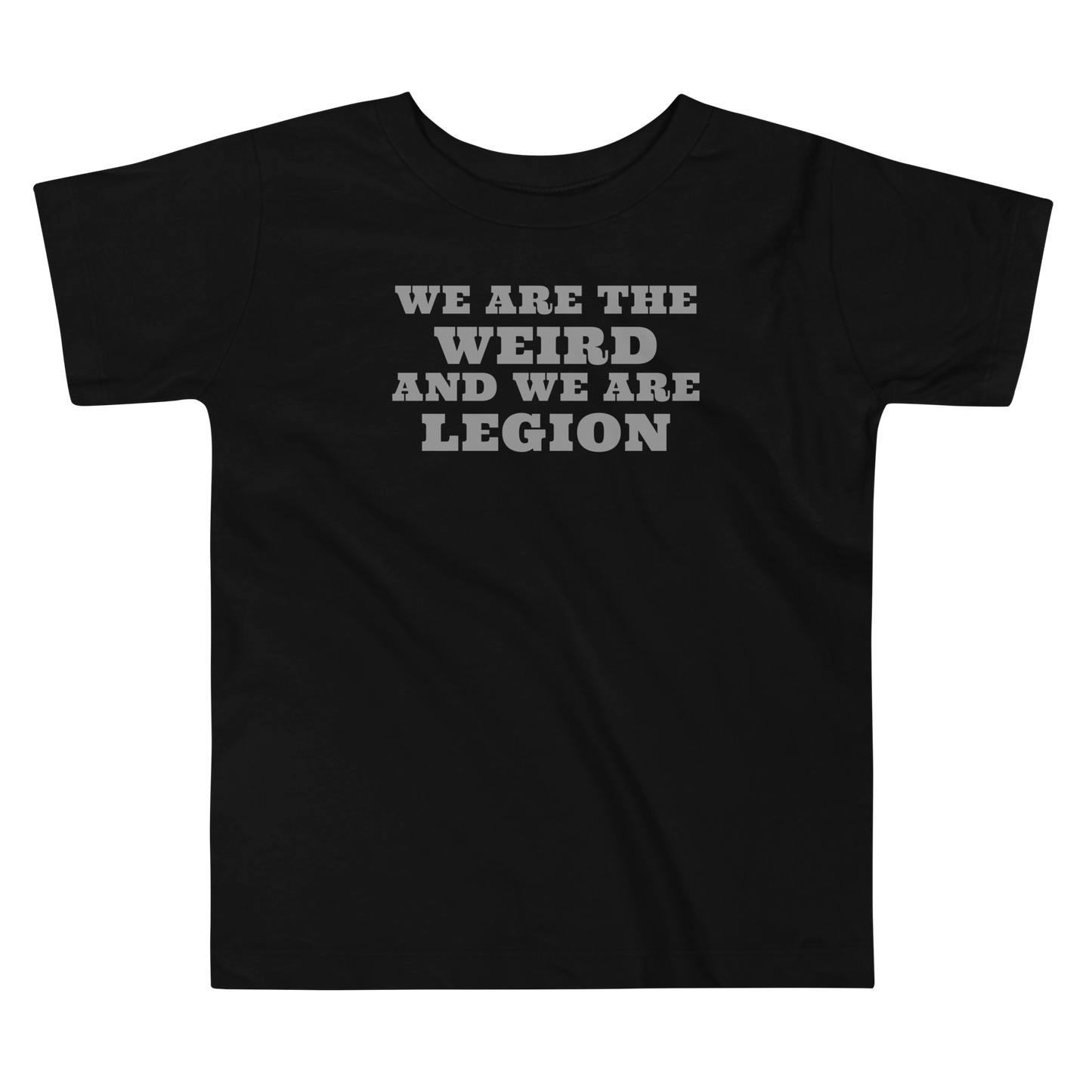 "We are the weird and we are legion" printed on a black toddler short sleeve tee laying on a flat surface