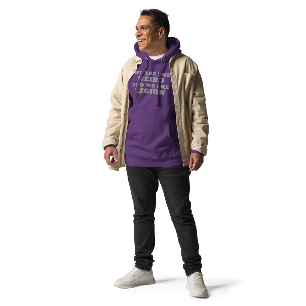 "We are the weird and we are legion" printed on a purple unisex hoodie worn by a male with a jacket on top