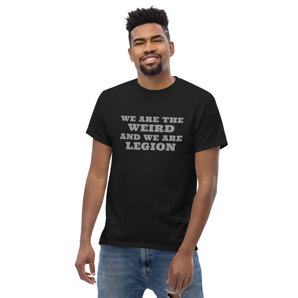 "We are the weird and we are legion" printed on a black unisex classic tee worn by a male