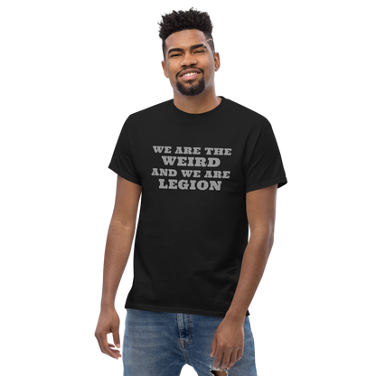 "We are the weird and we are legion" printed on a black unisex classic tee worn by a male
