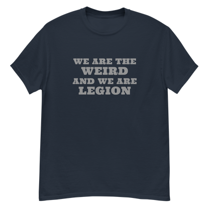 "We are the weird and we are legion" printed on a navy unisex classic tee laying on a flat surface