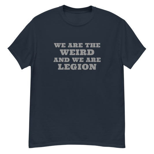 "We are the weird and we are legion" printed on a navy unisex classic tee laying on a flat surface