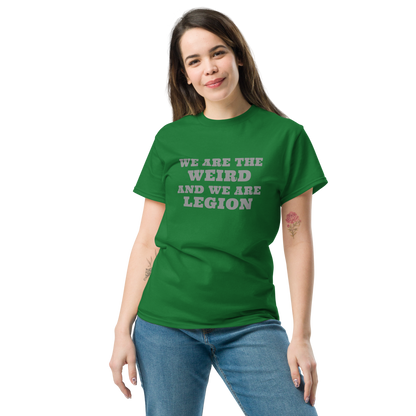 "We are the weird and we are legion" printed on a turf green unisex classic tee worn by a female