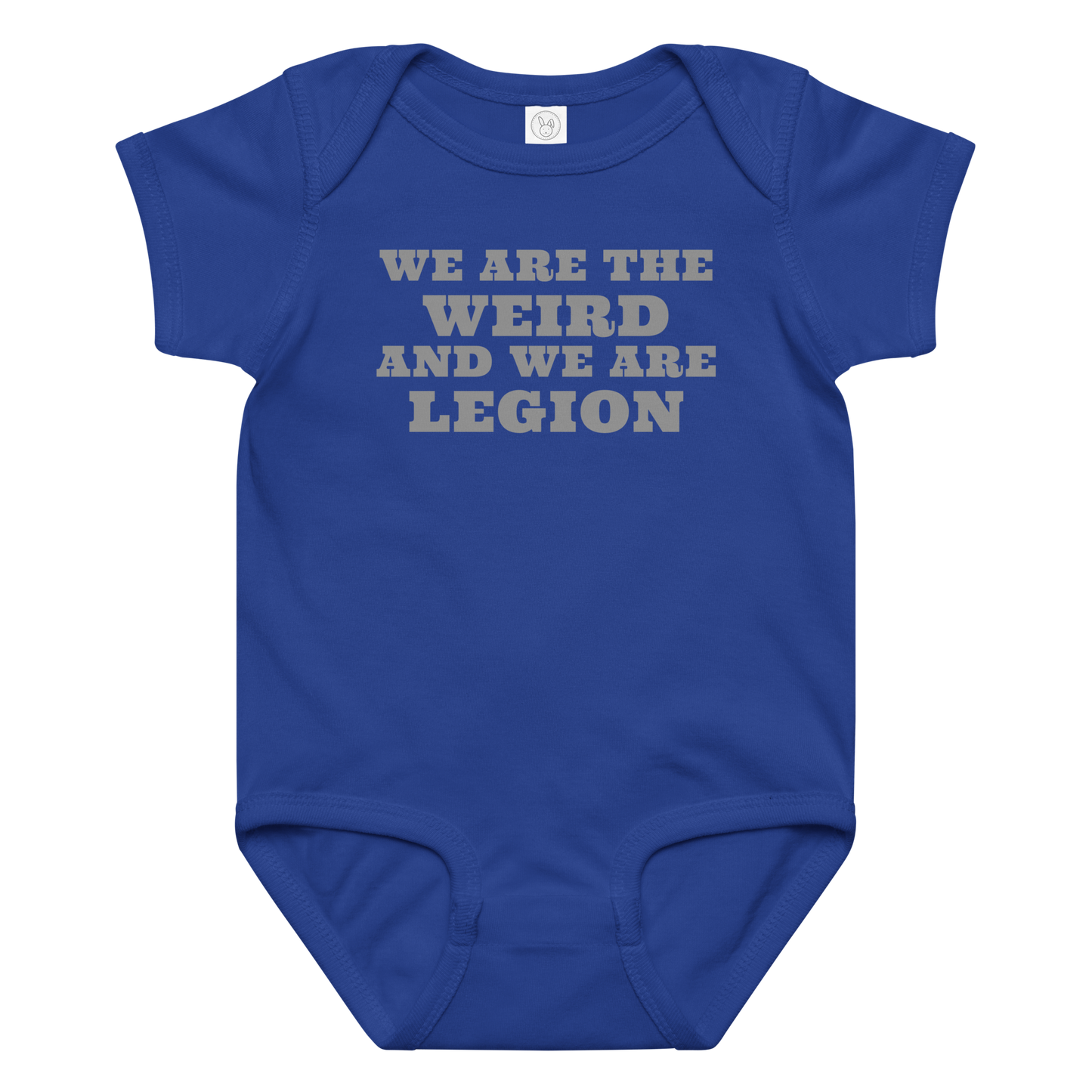 "We are the weird and we are legion" printed on a royal baby jersey bodysuit laying on a flat surface amongst other clothes