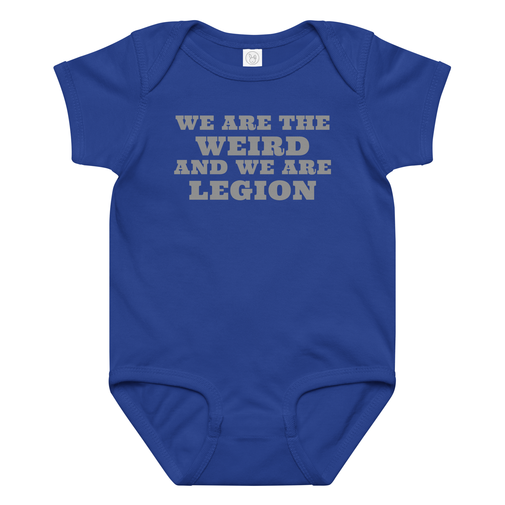 "We are the weird and we are legion" printed on a royal baby jersey bodysuit laying on a flat surface amongst other clothes