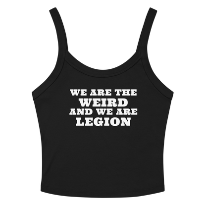 "We are the weird and we are legion" printed on a solid black blend women's micro-rib tanktop laying on a flat surface amongst sunglasses and shorts