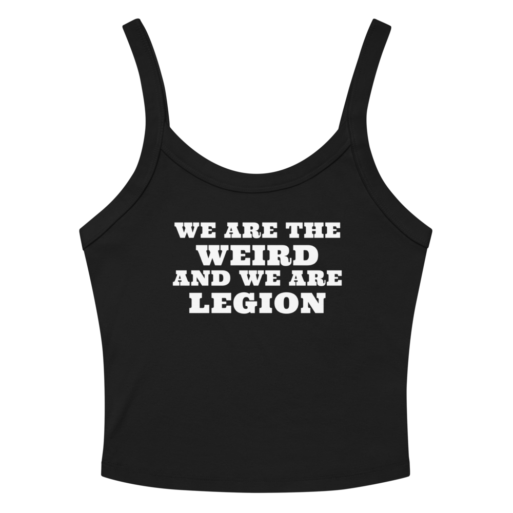 "We are the weird and we are legion" printed on a solid black blend women's micro-rib tanktop laying on a flat surface amongst sunglasses and shorts