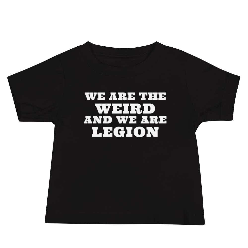 "We are the weird and we are legion" printed on a black baby jersey short sleeve tee laying on a flat surface