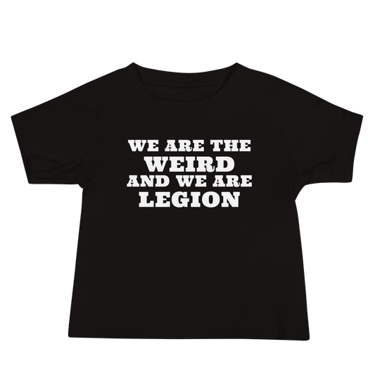 "We are the weird and we are legion" printed on a black baby jersey short sleeve tee laying on a flat surface