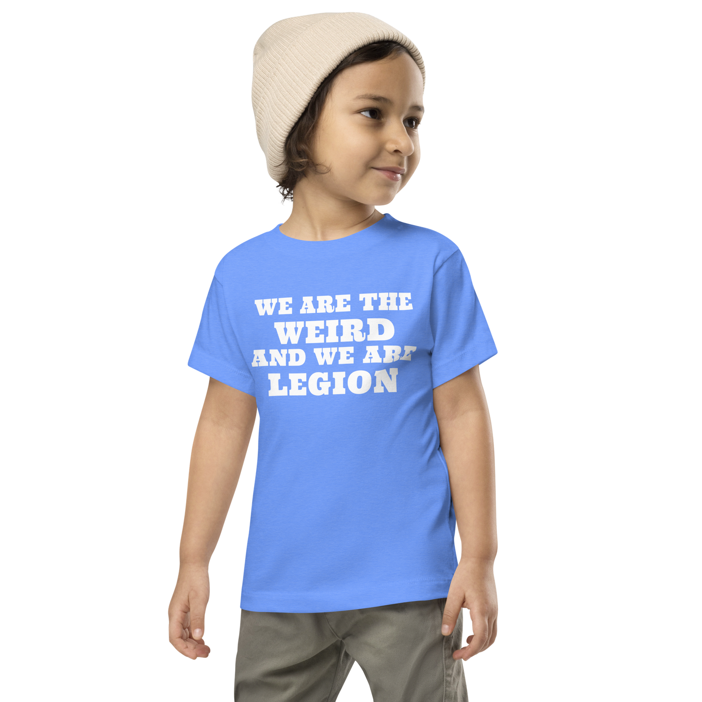 "We are the weird and we are legion" printed on a heather columbia blue toddler short sleeve tee worn by a male wearing a cap