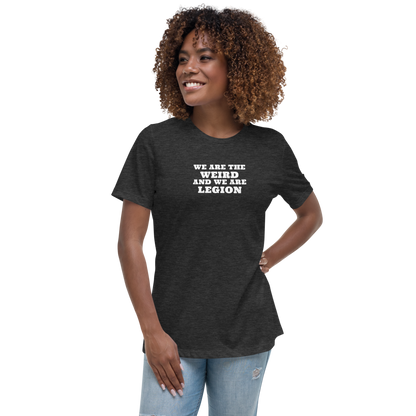 "We are the weird and we are legion" printed on a dark grey heather women's relaxed t-shirt worn by a female