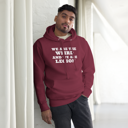 "We are the weird and we are legion" printed on a maroon unisex hoodie worn by a male