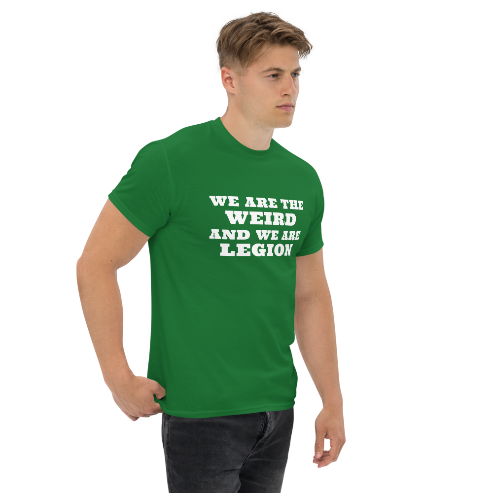 "We are the weird and we are legion" printed on a turf green unisex classic tee worn by a male