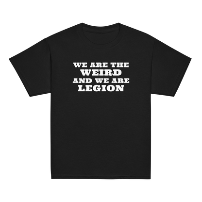 "We are the weird and we are legion" printed on a black youth classic tee laying on a flat surface