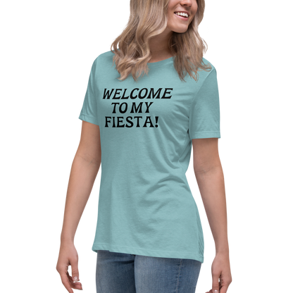 "Welcome to my fiesta!" printed on a heather blue lagoon women's relaxed t-shirt worn by a female